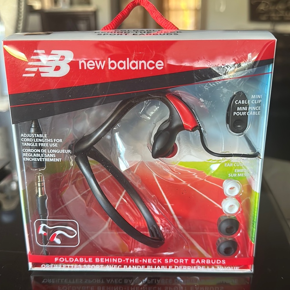 New Balance new in box foldable behind the ear sports earbuds. Never used